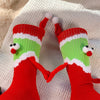 Chaussettes Père Noël tenant la main